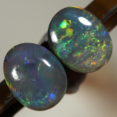 SOLID SEMI BLACK OPALS Matching pair. Bright multicolour